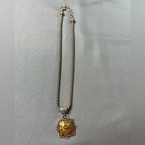 Vintage Brighton Pendant Necklace 9323 with dark red background